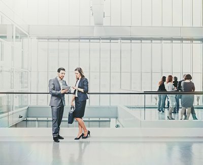 Two staff members having a general business conversation