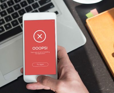 error screen showing a red screen on phone that says oops with a large cross