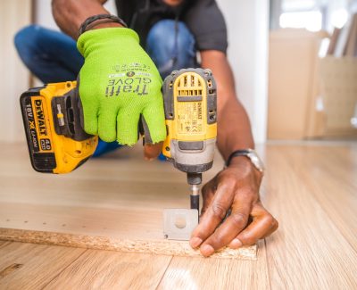 Carpenter using an electric drill