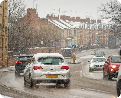 Cars on road driving during winter safely
